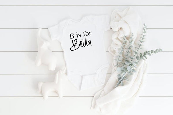 Baby name reveal idea- baby name bodysuit- personalized baby bodysuit - maternity picture idea- newborn baby shower gift basket idea