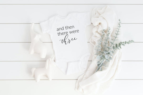 And then there were three four five baby body suit- baby announcement pregnancy reveal ideas- guess what surprise pregnant baby bodysuit