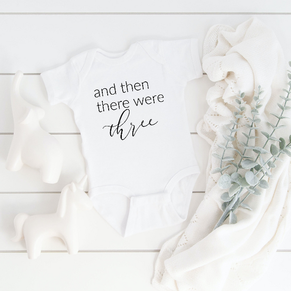 And then there were three four five baby body suit- baby announcement pregnancy reveal ideas- guess what surprise pregnant baby bodysuit